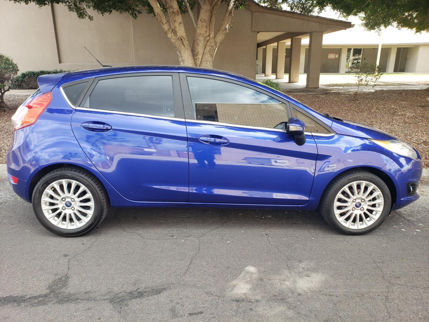 2014 /Tan and black Ford Fiesta Titanium (3FADP4FJ5EM) with an 1.6l i4 engine, 6-Speed Automatic transmission, located at 323 E Dunlap Ave., Phoenix, AZ, 85020, (602) 331-9000, 33.567677, -112.069000 - 2014 Ford Fiesta Titanium,.......A Must See!!... No accidents, Only 95K MILES.... Ice cold AC. The car is gorgeous inside and out. Power windows, Power door locks, Touch screen Stereo/ CD Player, Phone sync, Bluetooth, Satellite compatible, Backup camera, Beautiful tan and black interior with tan le - Photo#4